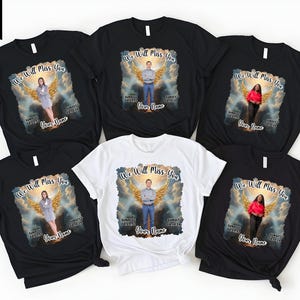 May include: A collection of black and white t-shirts featuring a memorial design. Each shirt displays a person with angel wings, the text "We Will Miss You", and space for a name and dates. The shirts are short-sleeved.