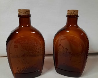 Brown Log Cabin Syurp glass bottle Statue of Liberty and Mount Rushmore collector's items purchase one ot both