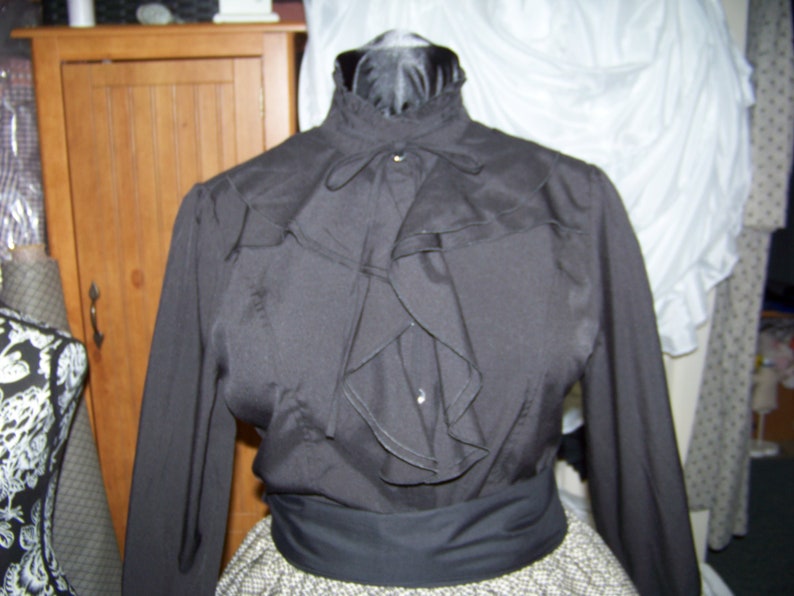 Civil War style ladies blouse Black cotton blend with ruffles in the front and around the neck
