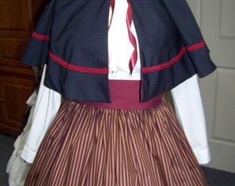 Dicken's Christmas Skirt in navy, golden brown and burgundy with burgundy Sash and Navy Wool Cape with burgundy braid trim lining one size.