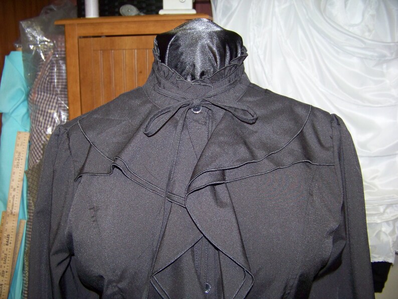 Civil War style ladies blouse Black cotton blend with ruffles in the front and around the neck