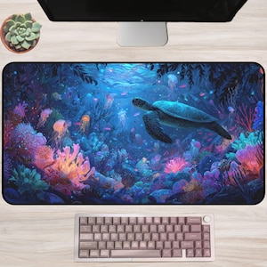 May include: A rectangular desk mat featuring a vibrant underwater scene with a sea turtle, jellyfish, and coral. The mat has a colorful design with shades of blue, purple, and orange. A keyboard is at the bottom.