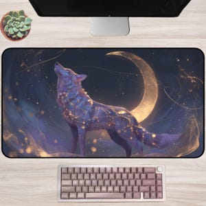 May include: A rectangular desk mat featuring a celestial wolf design. The wolf is depicted in shades of purple and blue, with glowing constellation patterns. A golden crescent moon and starry background complete the fantasy scene. A keyboard is at the bottom.