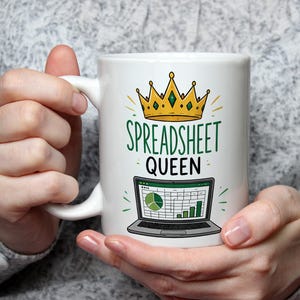 May include: A white ceramic mug featuring a graphic of a gold crown above the green text SPREADSHEET and black text QUEEN, with an illustration of an open laptop displaying a spreadsheet with a green pie chart and bar graph below the text.