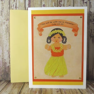 May include: A greeting card with a yellow, orange, and white border. The card features a cartoon illustration of a hula dancer wearing a red top, yellow skirt, and flower lei. The text on the card reads "You will be with me in Paradise." Luke 23:43