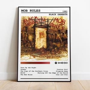 May include: A black and white album cover for the 1981 Black Sabbath album "Mob Rules". The cover art features a dark, gritty scene with a group of figures in hooded cloaks standing in front of a brick wall with graffiti that reads "Black Sabbath Mob Rules".