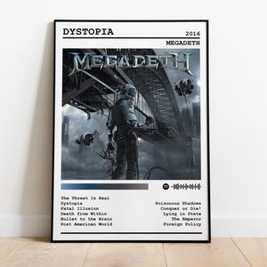 May include: A poster for the Megadeth album "Dystopia", released in 2016. The poster features a futuristic cityscape with a figure in a black suit standing in the foreground. The album title and band name are printed in white text at the top of the poster. The tracklist is printed in black text at the bottom of the poster.