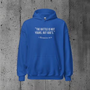 Christian hoodie with a powerful scripture quote from 2 Chronicles 20:15, designed for those seeking encouragement and motivation through their faith.