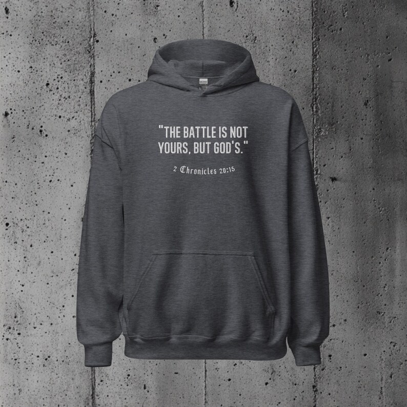 Hoodie with an empowering Bible verse about relying on God's strength during life’s challenges. A perfect choice for those who value their faith deeply.
