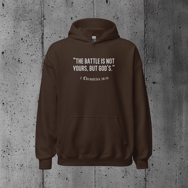 Christian pullover with the Bible verse "The battle is not yours, but God's." Suitable for wearing at church gatherings, daily errands, or simply sharing an uplifting message.