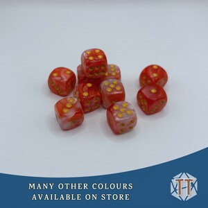 May include: A group of ten red and white dice with gold dots. The dice are scattered on a white surface.
