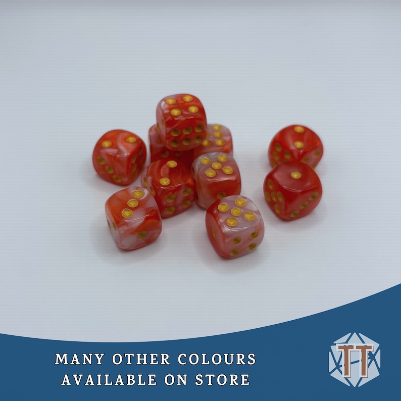 May include: A group of ten red and white dice with gold dots. The dice are scattered on a white surface.