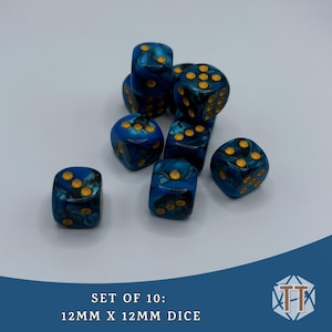 May include: Set of 10 blue and gold marbled dice. Each die is 12mm x 12mm. The dice are scattered on a white surface.  SET OF 10: 12MM X 12MM DICE