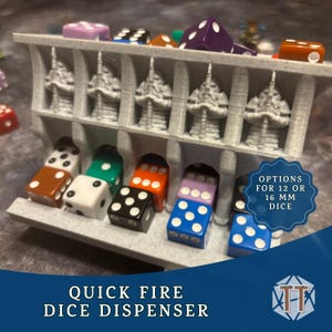 May include: A gray 3D-printed dice dispenser with a decorative design, holding various colored dice. The dispenser has slots for dice to be dispensed. Text on the image reads "QUICK FIRE DICE DISPENSER" and "OPTIONS FOR 12 OR 16 MM DICE."