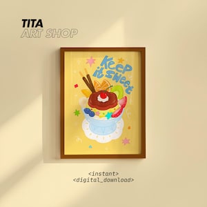 May include: A framed art print featuring a colorful illustration of a sundae with fruit and chocolate. The words "Keep it Sweet" are written in blue. The print is in a brown frame and has the text "TITA ART SHOP" at the top.