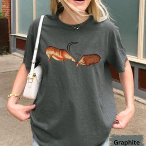 Primitive Bull and Deer Fight Graphic Tee - Ancient Cave Art Design Shirt - Minimalist Nature-Inspired Apparel