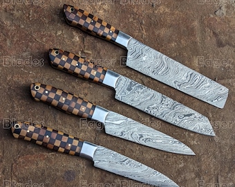 May include: Four Damascus steel kitchen knives with wooden handles featuring a checkered pattern. The knives are arranged in a row on a brown textured surface.