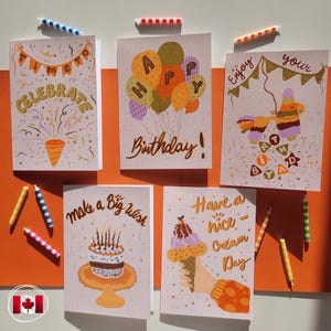May include: A selection of birthday cards with illustrations and text. One card says "Celebrate", another says "Happy Birthday!" with balloons, and others say "Enjoy your", "make a Big wish", and "Have a nice Cream Day".