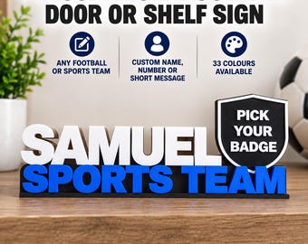 May include: A personalised football door or shelf sign featuring the white text SAMUEL and blue text SPORTS TEAM. A black shield-shaped icon on the right displays the white text PICK YOUR BADGE. The sign includes icons for custom text, team names, and colour options.