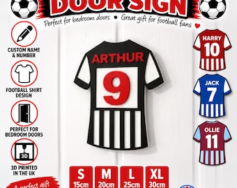 May include: A personalised football shirt door sign featuring the name ARTHUR and the number 9 in red. The shirt is black and white with short sleeves. The image includes text options for sizes S, M, L, and XL, ranging from 15cm to 30cm.