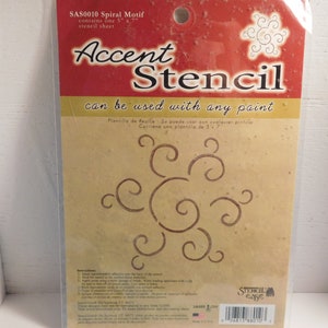 May include: A brown and beige package for a 5" x 7" stencil sheet with a spiral motif. The package says "Accent Stencil" and "can be used with any paint".