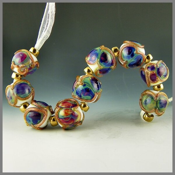 Opulence - a set of 9 round beads with colorful Fire Opal glass and gold adventurine