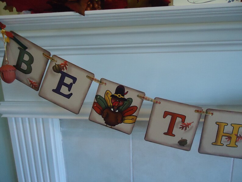 May include: A Thanksgiving banner with the words "Be Thankful" in colorful letters. The banner features a turkey illustration and autumn leaves.