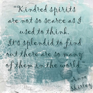 May include: A blue and white textured background with a quote in dark blue cursive writing. The quote reads "Kindred spirits are not so scarce as I used to think. It's splendid to find out there are so many of them in the world." The quote is attributed to Anne Shirley.