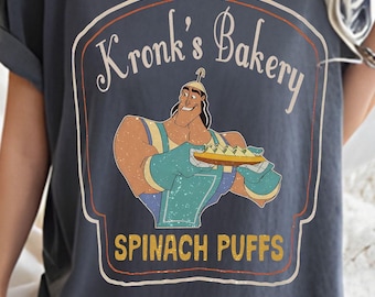 Camiseta de los Villanos de Disney: El Emperador y sus Locuras, divertida camiseta de hojaldre de espinacas de Kronk's Bakery, viaje familiar a Disney 2026, vacaciones en Magic Kingdom