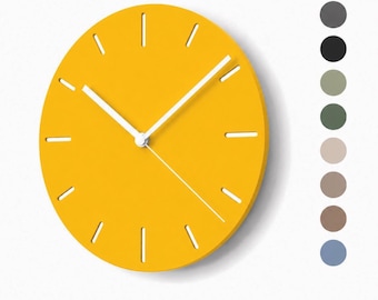 May include: A round yellow wall clock with white hour and minute hands and a thin white second hand. The clock face features white cut-out slots for hour markers. To the right of the clock, there is a vertical column of eight solid color circles.