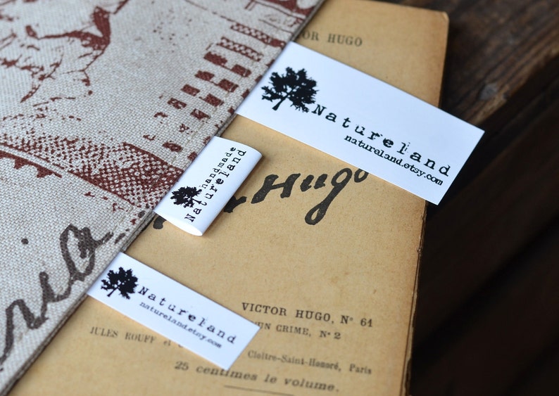 May include: Three white fabric labels with black text and a small tree graphic. The labels read "handmade Natureland", "Natureland naturaland.etsy.com", and "Natureland naturaland.etsy.com".