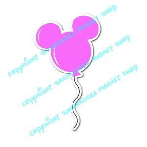 May include: A pink balloon-shaped magnet with a white border, featuring the iconic mouse ears design. The magnet has a wavy black string attached. The words "COPYRIGHT SANDY AND SEA MAGNET SHOP" are printed diagonally across the image.