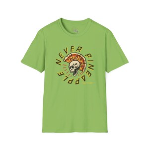 May include: A green t-shirt with a graphic of a skull wearing a pizza slice as a helmet. The text "Never Pine Apple" is written around the skull.