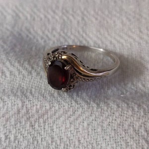 Vintage Sterling silver and garnet ring size 8. With diamond accent's.