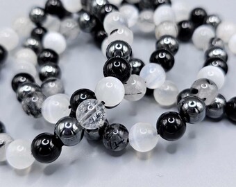 Protective grounding bracelet.  Black tourmaline, selenite, hematite, and rutilated quartz.