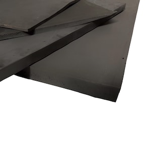 May include: A stack of black foam sheets. The sheets are thick and have a smooth surface.