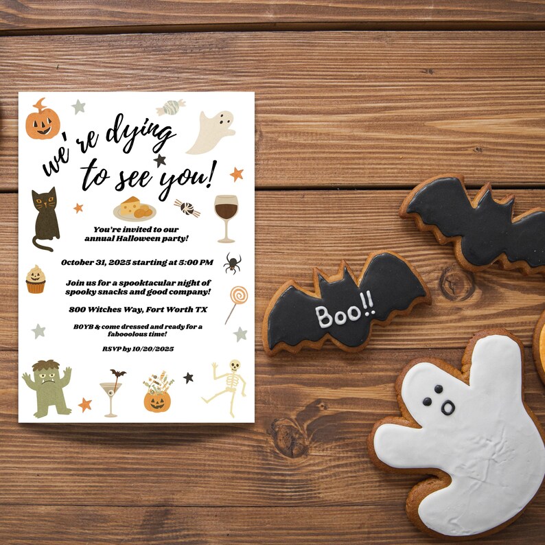 May include: A Halloween party invitation with the text "We're dying to see you!" and event details. The image also features Halloween-themed cookies shaped like bats and ghosts, set on a wooden surface.