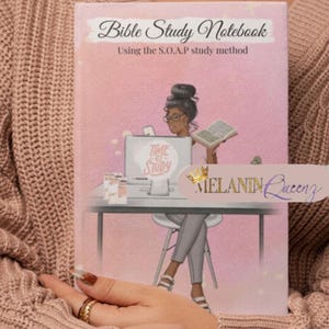 May include: A pink and white notebook with the text "Bible Study Notebook" and "Using the S.O.A.P study method". The cover features an illustration of a woman with brown skin and black hair sitting at a desk with a computer and a book. The text "MELANIN Queenz" is also on the cover.