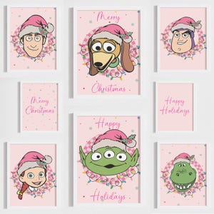 May include: A set of framed art prints with cartoon characters in Santa hats and fairy lights. The prints have a pink background with the words "Merry Christmas" and "Happy Holidays".