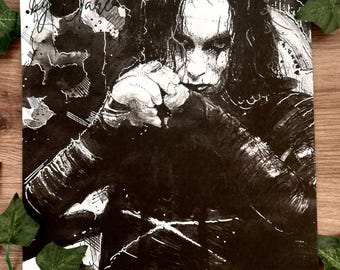 May include: Black and white illustration of a person with dark hair and pale skin, reminiscent of a gothic aesthetic. The artwork features detailed shading and expressive lines, with text in the upper left corner. The image is framed with green ivy.