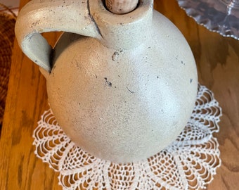 Primitive antique stoneware jug with cork 11 inches tall 21 inches around