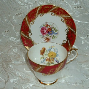 Vintage Paragon By Appointment for  Her Majesty the Queen Tea Cup and Saucer Pink  Rose White Gold Floral