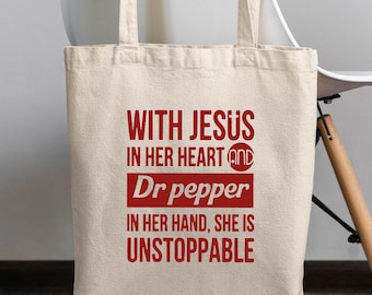 With Jesus in Her Heart Dr Pepper in Her Hand She’s Unstoppable Tote Bag, Christian Faith Bag, Funny Dr Pepper Lover Gift,Religious Tote Bag