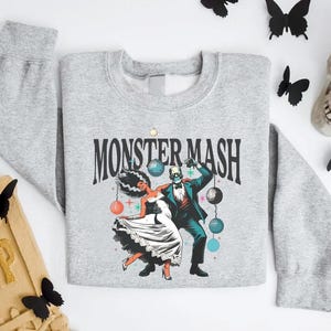 a sweater with a picture of a man and a woman on it
