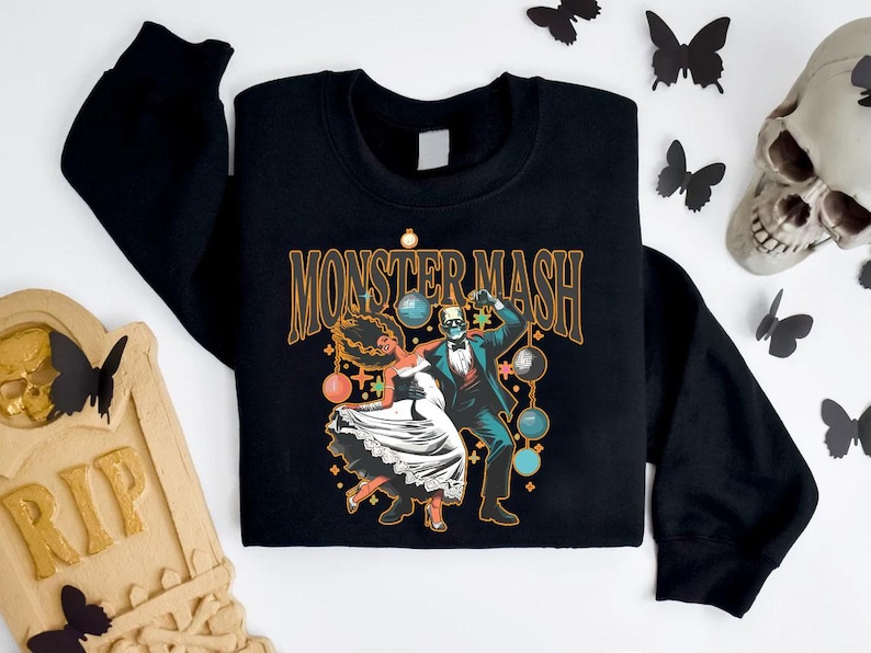 a black shirt with a picture of a skeleton on it