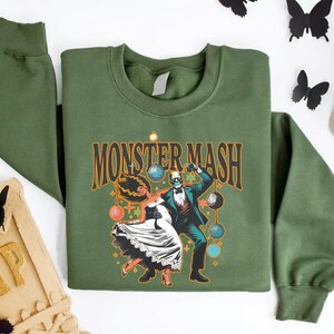 a green shirt with a skeleton and a skeleton on it