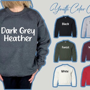 May include: A dark grey heather sweatshirt is shown, with the words "Dark Grey Heather" in white. The image also displays a youth color chart with sweatshirts in black, sport grey, forest green, maroon, white, and red.