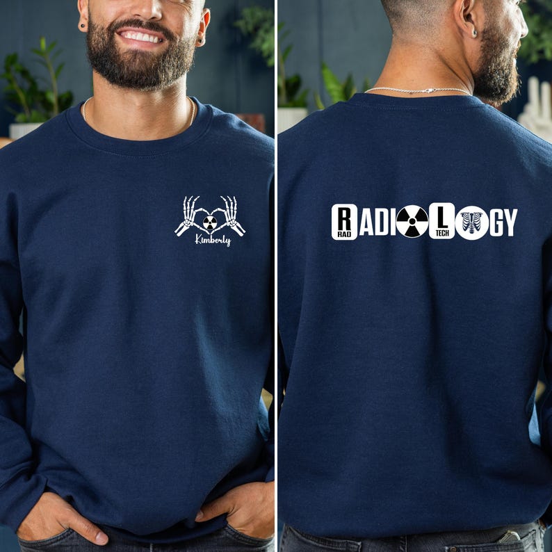 May include: A navy blue sweatshirt with a white skeleton hand design on the front that says "Kimberly" and a white design on the back that says "RADIOLOGY" with a radiation symbol and a ribcage graphic.