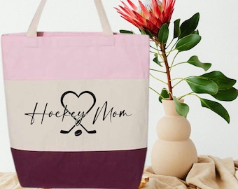 Hockey Mom Tote Bag with Heart and Sticks Design, Sports Zipper Bag for Game Days, Proud Hockey Parent Gift, Team Mom Canvas Bag