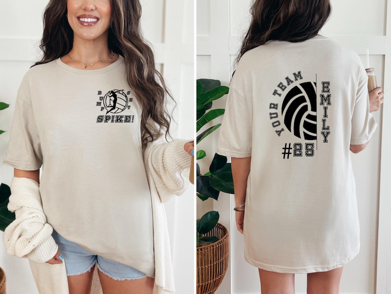 May include: An oversized beige t-shirt with a volleyball graphic and the text "SPIKE!" on the front and "YOUR TEAM EMILY #28" on the back.